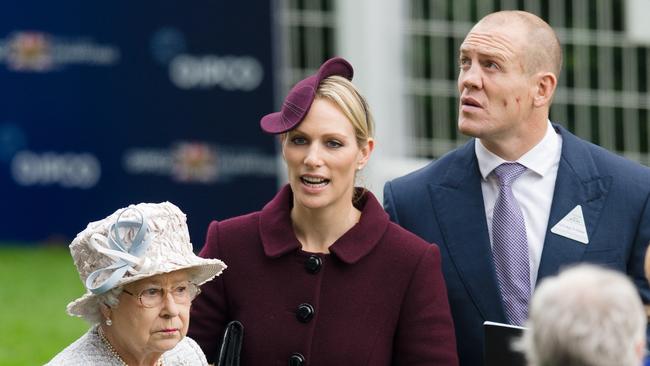 Britain's Queen Elizabeth II, Zara Tindall and her husband Mike Tindall (Photo by LEON NEAL / AFP)