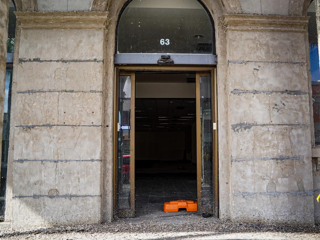 A rare glimpse inside the abandoned heritage-listed former Commonwealth Bank building with the front entrance adorned with pigeon poo. Picture: Heidi Petith