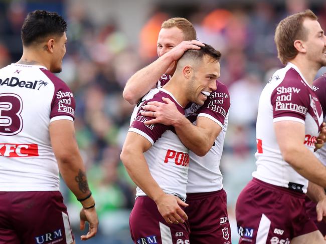 CANBERRA, AUSTRALIA - AUGUST 10: Luke Brooks of the Eagles celebrates scoring a try with team mates during the round 23 NRL match between Canberra Raiders and Manly Sea Eagles at GIO Stadium, on August 10, 2024, in Canberra, Australia. (Photo by Mark Nolan/Getty Images)