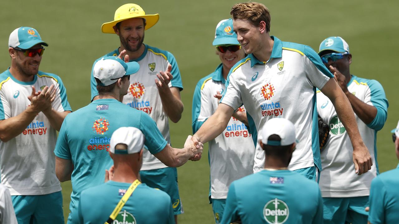 Cameron Green is handed his ODI cap by Steve Smith. Picture. Phil Hillyard