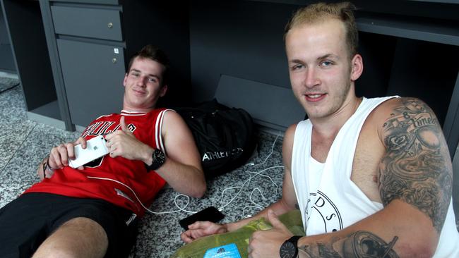 Australian Jake Vidler 21 (R) and his brother Ben Viddlet from Nelson Bay stranded in Bali Airport after their Jetstar flight was canceled last night caused by Mount Agung eruption. Jake should go for work on monday and he possibly lost his job as a house builder after as Jetstar put them on Wednesday flight. Picture: Lukman S Bintoro