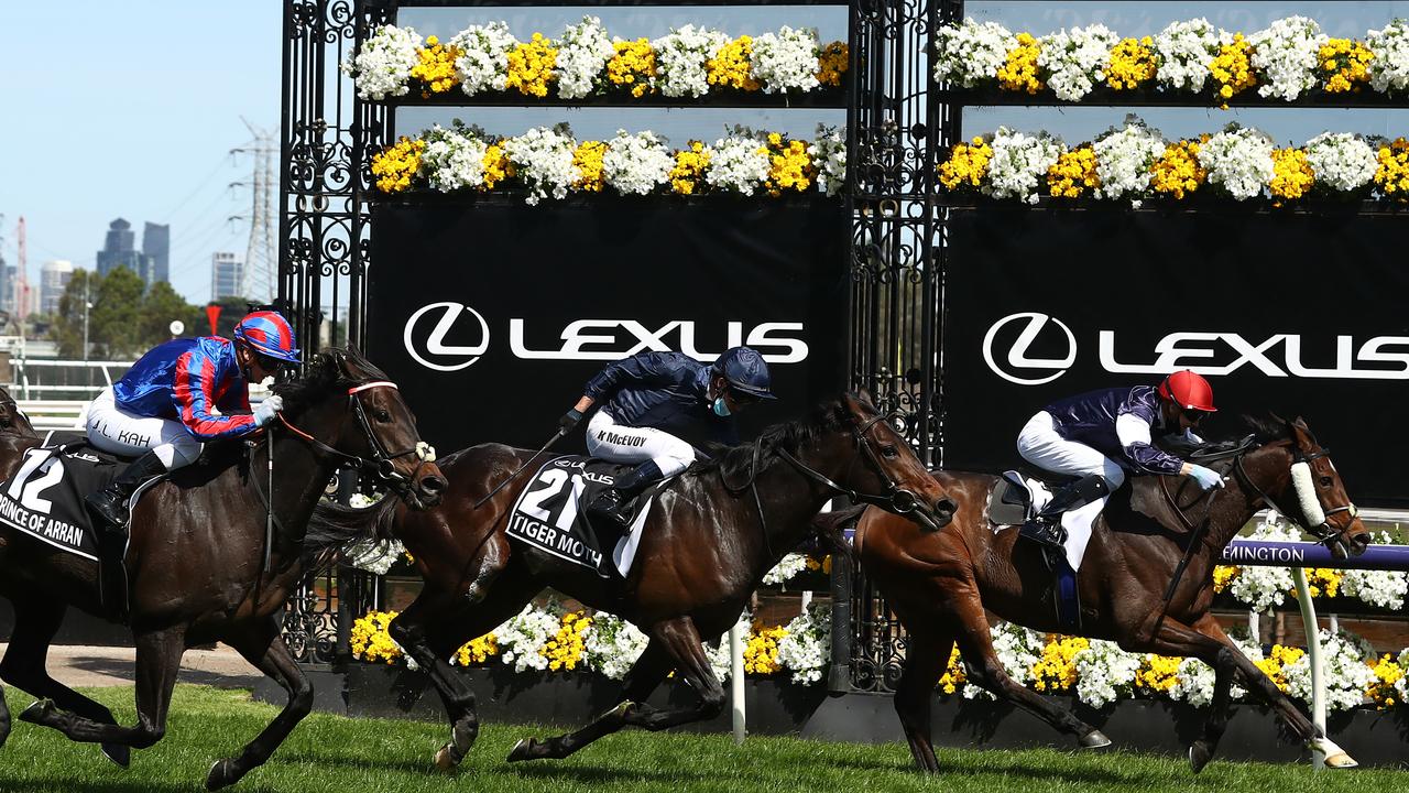 MELBOURNE, AUSTRALIA - NOVEMBER 03: Jye Mcneil riding Twilight Payment wins race 7, the Lexus Melbourne Cup ahead of Kerrin Mcevoy riding #21 Tiger Moth and Jamie Kah riding #12 Prince Of Arran during 2020 Lexus Melbourne Cup Day at Flemington Racecourse on November 03, 2020 in Melbourne, Australia. (Photo by Robert Cianflone/Getty Images for the VRC)