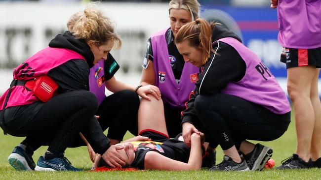 Trainers check on Alice Burke.