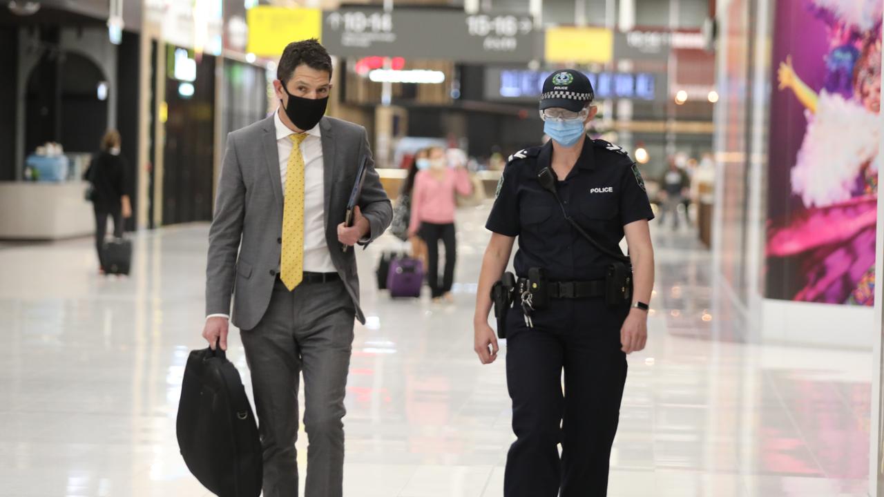 SA Senator Alex Antic being escorted out of Adelaide Airport. Picture: Dean Martin