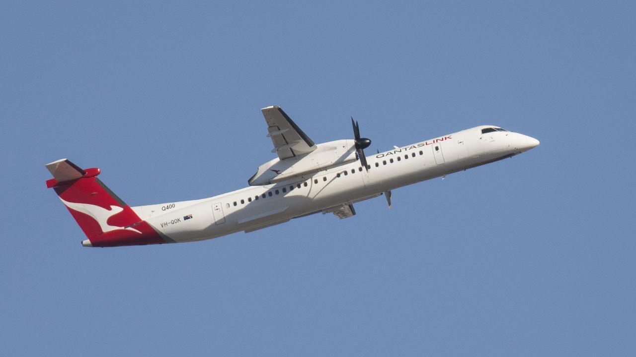 The QantasLink DHC-8 400 Series aircraft, with 74 economy seats.