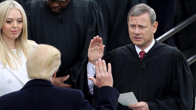 Donald Trump takes the oath of office from Supreme Court Chief Justice John Roberts at the US Capitol in Washington in January 2017. Picture: AFP