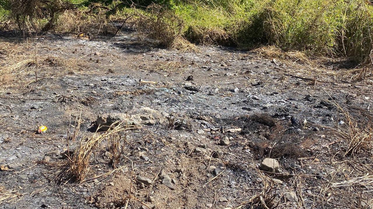 The pool of scorched earth where the flaming SUV came to a rest after it left the Wide Bay Highway in the early hours of Saturday, July 24.