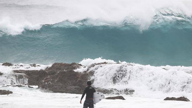 Surfers at Snapper Rocks and Kirra riding the Large swell produced by Cyclone OMA. Photograph : Jason O'Brien