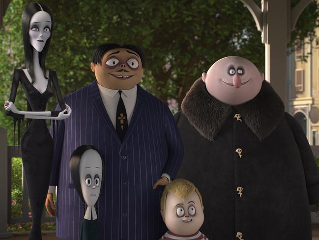 Morticia (Charlize Theron), Wednesday (Chloe Grace Moretz), Gomez (Oscar Isaac), Pugsley (Finn Wolfhard), and Uncle Fester (Nick Kroll) in a scene from the movie The Addams Family. Supplied by Universal Pictures.