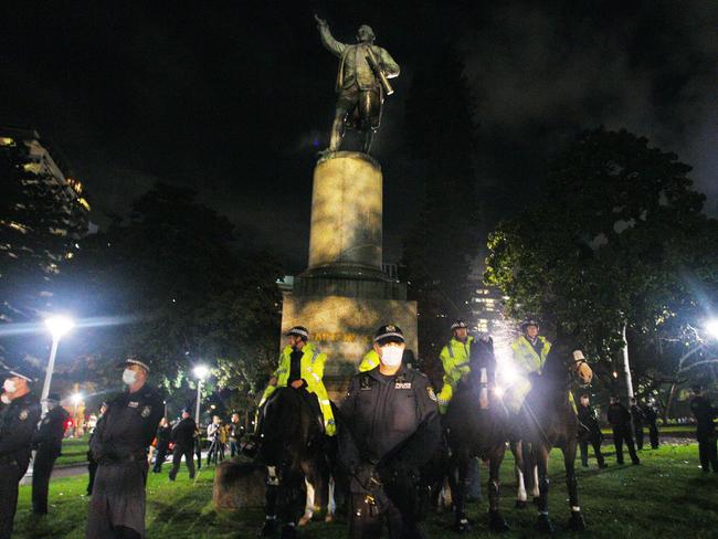 SYDNEY, AUSTRALIA - JUNE 12: New South Wales police stand guard around a statue of Captain Cook in Hyde Park on June 12, 2020 in Sydney, Australia. The rally was organised to protest against Aboriginal deaths in custody and in solidarity with the global Black Lives Matter movement. 437 Aboriginal and Torres Strait Islander people have died in custody across Australia since the 1991 Royal Commission into Aboriginal Deaths In Custody. As the protest is unauthorised by authorities, NSW police have the power to arrest and prosecute attendees for breaking a current COVID-19 health order which bans mass gatherings. (Photo by Lisa Maree Williams/Getty Images)