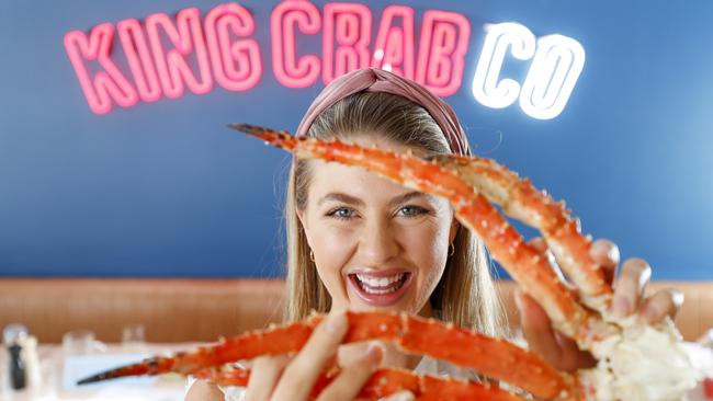 Karleigh Pearson samples the crab delights at the new restaurant King Crab Co at Marina Mirage. Picture: Tim Marsden.