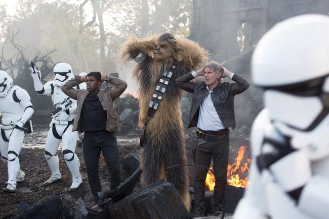 FOR REVIEW AND PREVIEW PURPOSES ONLY. John Boyega, Peter Mayhew (as Chewbacca) and Harrison Ford in a scene from the movie Star Wars: The Force Awakens. Supplied by Disney. Please credit photo to David James. Picture: David James