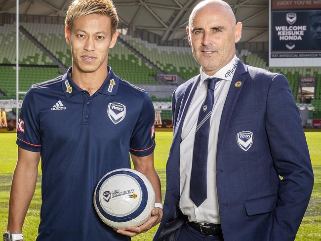 New Melbourne Victory signing Keisuke Honda (left) and Victory coach Kevin Muscat pose for a photo during a Melbourne Victory A-League press conference at AAMI Park in Melbourne, Wednesday, August 15, 2018. (AAP Image/Daniel Pockett) NO ARCHIVING