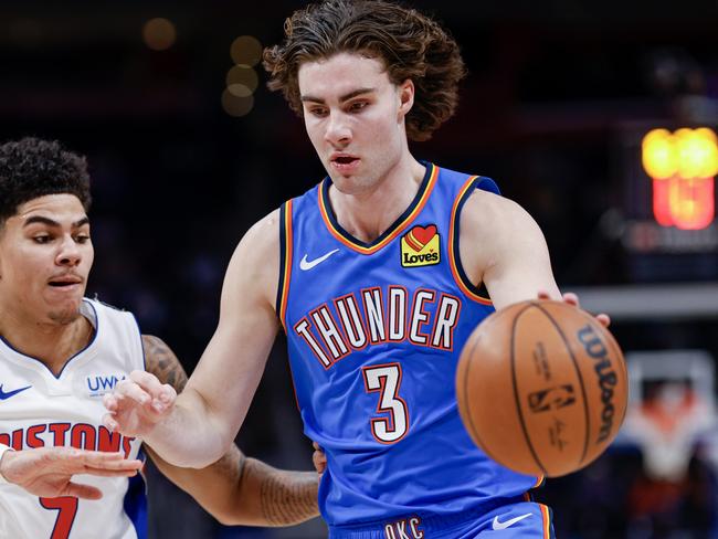 DETROIT, MICHIGAN - JANUARY 28: Josh Giddey #3 of the Oklahoma City Thunder dribbles the ball against Killian Hayes #7 of the Detroit Pistons in the first quarter of a game at Little Caesars Arena on January 28, 2024 in Detroit, Michigan. NOTE TO USER: User expressly acknowledges and agrees that, by downloading and or using this photograph, User is consenting to the terms and conditions of the Getty Images License Agreement. (Photo by Mike Mulholland/Getty Images)