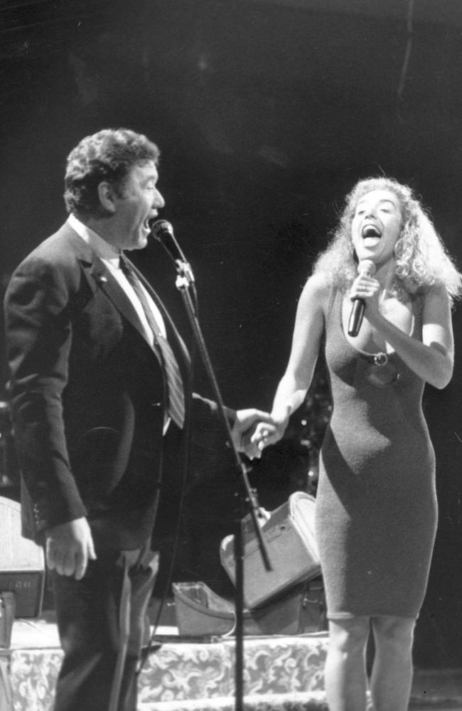 Richard Pratt singing with daughter Heloise at a Visy Christmas party in 1987.