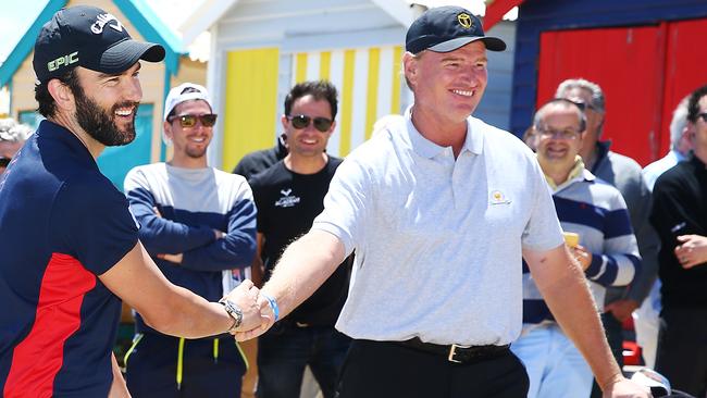 MELBOURNE, AUSTRALIA - NOVEMBER 26: Golfer Ernie Els of South Africa and Melbourne Demons' Jordan Lewis shake hands during The Big Easy's BBQ at Brighton Beach Boxes on November 26, 2018 in Melbourne, Australia. Eels will be International Team Captain at the Presidents Cup next year in Melbourne. (Photo by Michael Dodge/Getty Images)