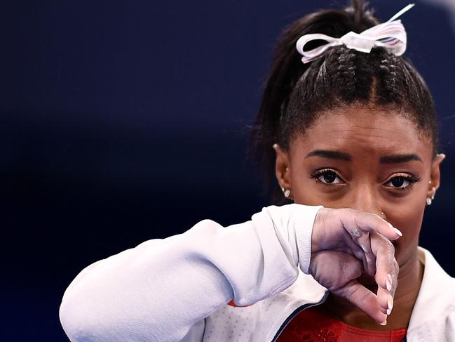 USA's Simone Biles gestures during the artistic gymnastics women's team final during the Tokyo 2020 Olympic Games.