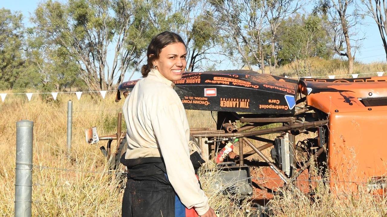 Driver Shannon Lander's daughter and navigator lets others drivers know they are okay as they pass the 30km mark on the first day of Finke Desert Race 2022. Picture: (A)manda Parkinson