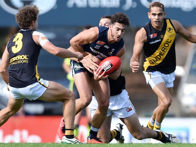 South Adelaide’s Nic Schwarz under pressure from the Glenelg defence. Picture: Roger Wyman