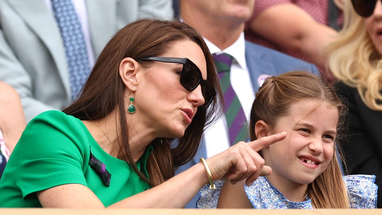 Catherine appears to be explaining the on-court antics to Charlotte. Picture: Getty Images