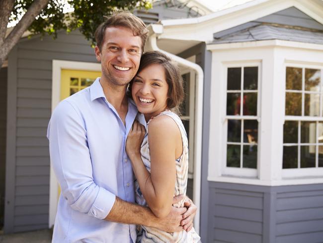 A couple who have just signed up a mortgage after buying their first house. Generic first home buyers Picture: iStock.