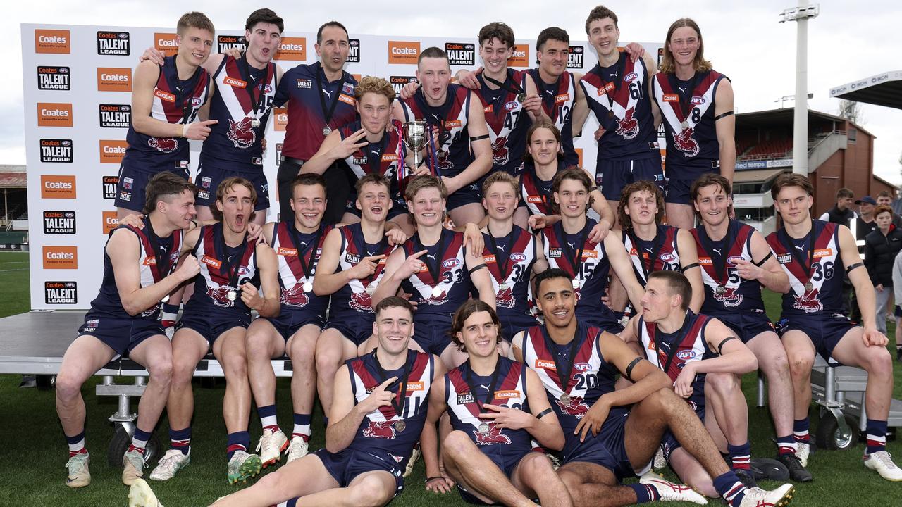 Sandringham Dragons players celebrate after winning the 2024 Coates Talent League boys grand final. Picture: Martin Keep/AFL Photos via Getty Images