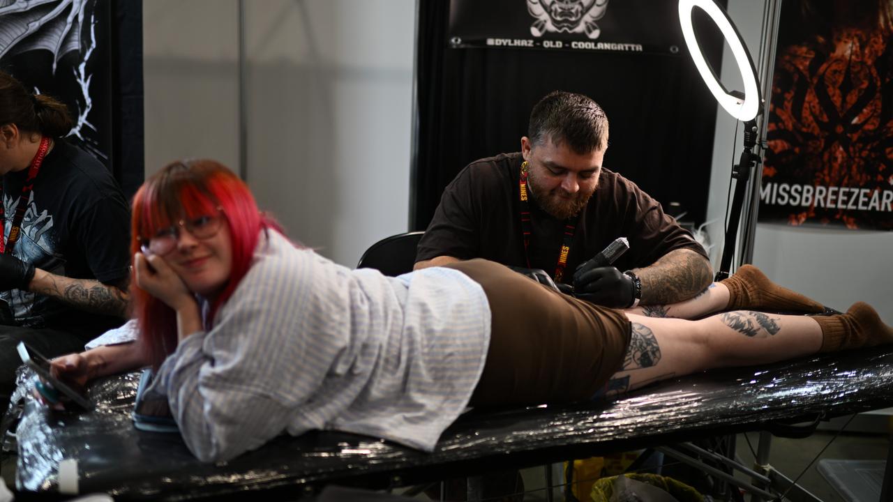 Another woman has her own leg worked on. Picture: Dan Peled / NewsWire