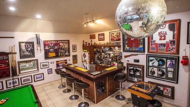 Inside Corey Parker’s ‘man cave’, which is full of sporting memorabilia. Picture: Nigel Hallett.