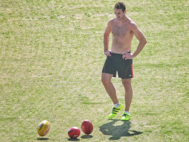 Jobe Watson reacquaints himself with footy training. Picture: Hamish Blair