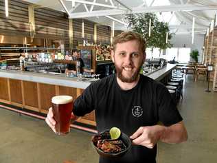 The $10 million revitalisation has brought the Wharf Mooloolaba back to a hub of activity with for fashion and food.The Dock offers great food and a wide range of beers. Charlie Taylor serves up a tasty treat. Picture: Warren Lynam