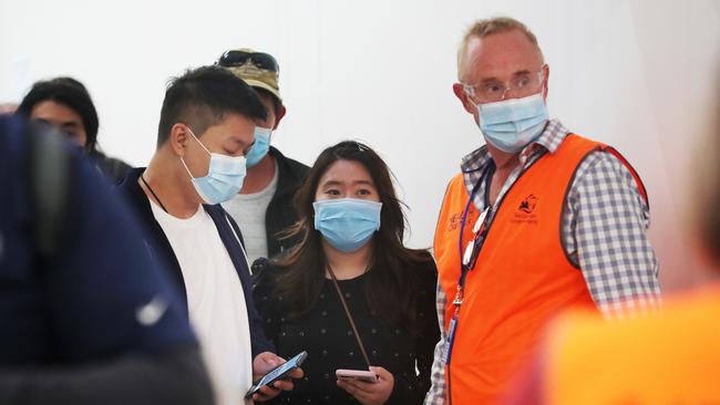 Arrivals to Hobart screened at Hobart Airport after Tasmania closed it's border with Victoria. Picture: Nikki Davis-Jones