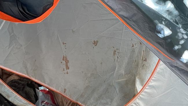 WHat appear to be blood splatters on the entrance to the woman’s tent. Picture: Supplied.
