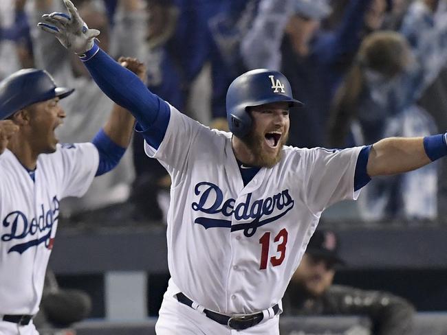 Los Angeles Dodgers' Max Muncy celebrates his walk off home run against the Boston Red Sox during the 18th inning in Game 3 of the World Series baseball game on Saturday, Oct. 27, 2018, in Los Angeles. (AP Photo/Mark J. Terrill)