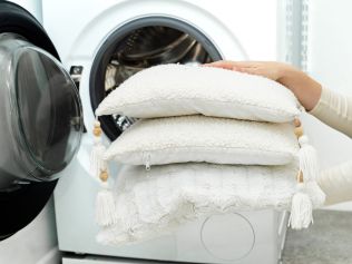 Opting for a larger size washer dryer makes it easier to load bedding and other bulky items. Picture: iStock/Damian Lugowski.