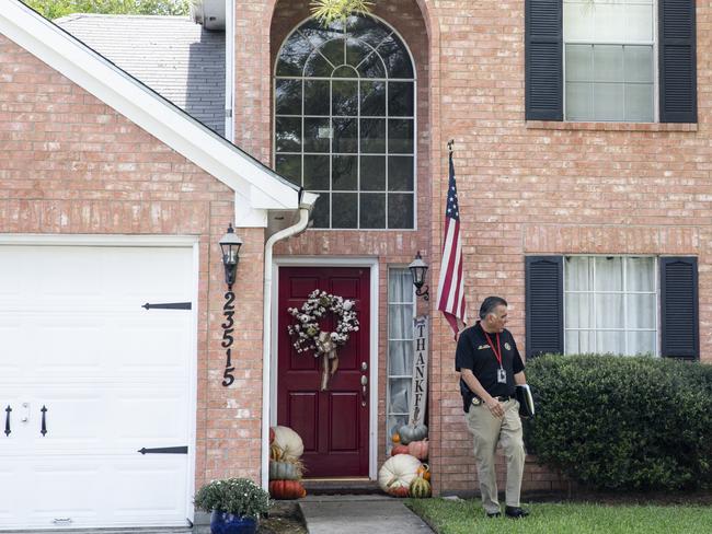 Detective Thomas Cantu of the Fort Bend County Sheriff's Office canvasses the neighborhood in Katy, Texas. Picture: Scott Dalton