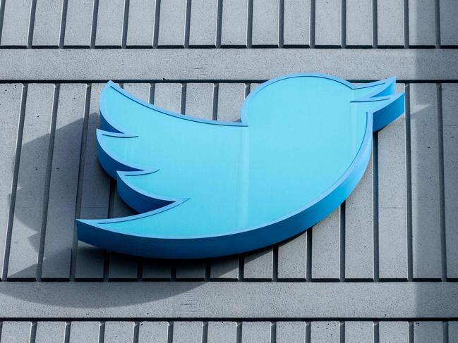 (FILES) In this file photo taken on October 28, 2022 The Twitter logo is seen on a sign on the exterior of Twitter headquarters in San Francisco, California. - Thousands of Twitter users on February 8, 2023, reported problems using the platform as the Elon Musk-owned social network began letting paying users post tweets as long as 4,000 characters. (Photo by Constanza HEVIA / AFP)