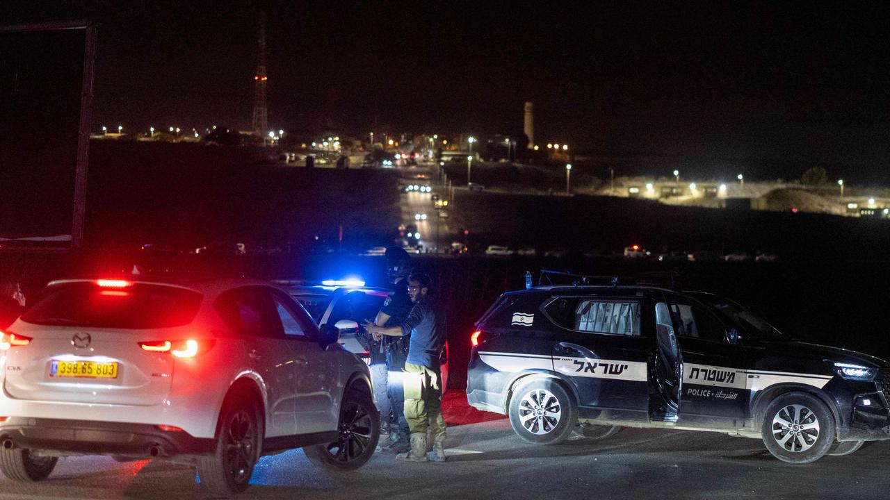 Israeli security forces secure the area at the site of a drone strike near the northern Israeli town of Binyamina. Picture: Oren ZIV/AFP