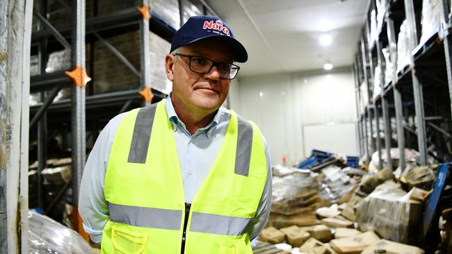 Scott Morrison inspects the flood damage at the Norco Ice Cream factory in Lismore, in northern NSW, on March 9. Picture: NCA NewsWire/Elise Derwin