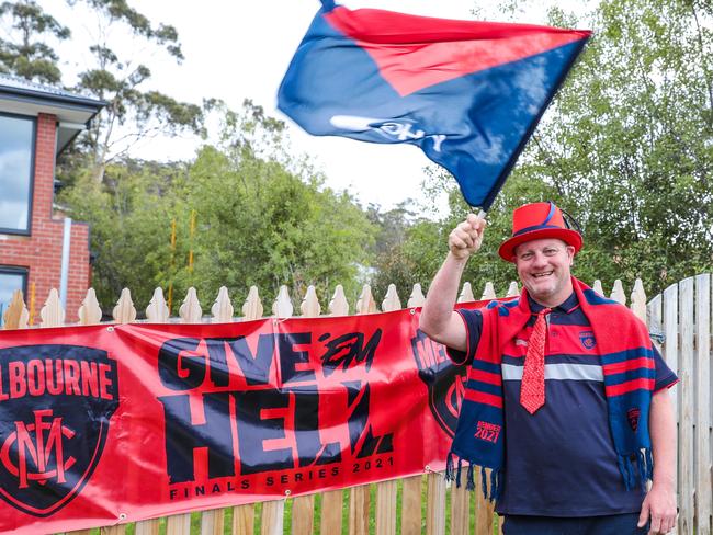 Scott Archer at home celebrating Melbourne’s AFL grand final win. Picture: Mireille Merlet