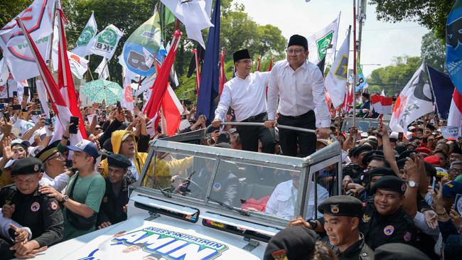 Anies Baswedan and Muhaimin Iskandar arriv at election committee headquarters in Jakarta on Thursday. Picture: AFP