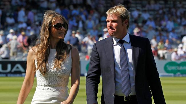 Shane Warne and Liz Hurley. Picture: AFP