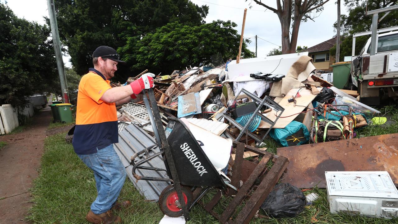 Arron Gerrey cleaning up on Diadem St in Lismore. Photo: Jason O'Brien