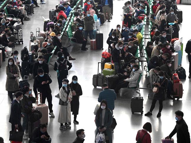 Passengers wearing face masks at Changsha railway station in Changsha, China's central Hunan province. Picture: AFP