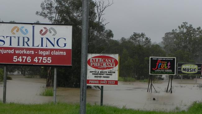 The aftermath of the January 2011 flooding at the bridge crossing Petrie Creek near Nambour's Quota Park. Giant tree stumps were carried downstream and deposited on the bridge by the fast moving water. Photo Mark Furler / Sunshine Coast Daily