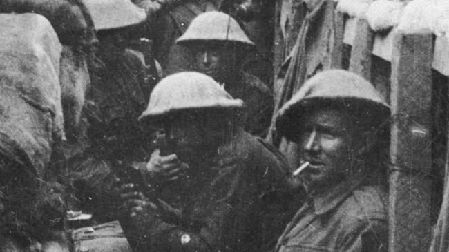 Calm before the storm: Bill Stray’s mates, men of the 53rd Battalion, waiting to don their equipment for the attack at Fromelles. Only three of the men shown here came out of the action alive, and those three were wounded (Courtesy: Australian War Memorial)