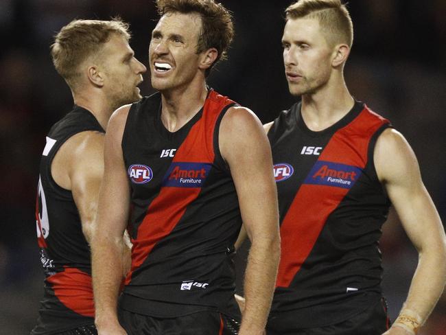 Mitch Brown of the Bombers (centre) looks dejected during the Round 2 AFL match between the Essendon Bombers and St Kilda Saints at Marvel Stadium, Melbourne, Saturday, March 30, 2019. (AAP Image/Daniel Pockett) NO ARCHIVING, EDITORIAL USE ONLY