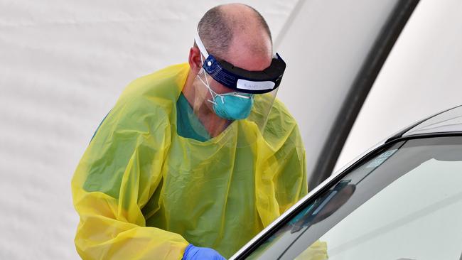 Anyone with symptoms are being asked to get tested. (Photo by Saeed KHAN / AFP)