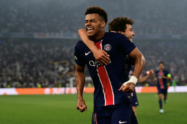 Desire Doue (L) celebrates after scoring one of his two goals in Paris Saint-Germain's resounding victory in the Champions League final