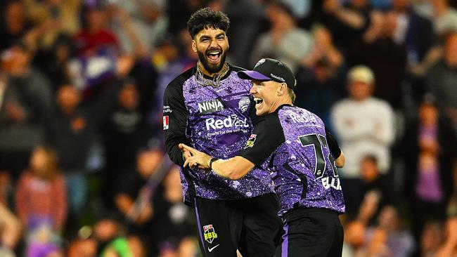 Nathan Ellis and Nikhil Chaudhary of the Hurricanes celebrate the win during the BBL Qualifier match between the Hobart Hurricanes and Sydney Sixers at Ninja Stadium on January 21, 2025 in Hobart, Australia. (Photo by Steve Bell/Getty Images)