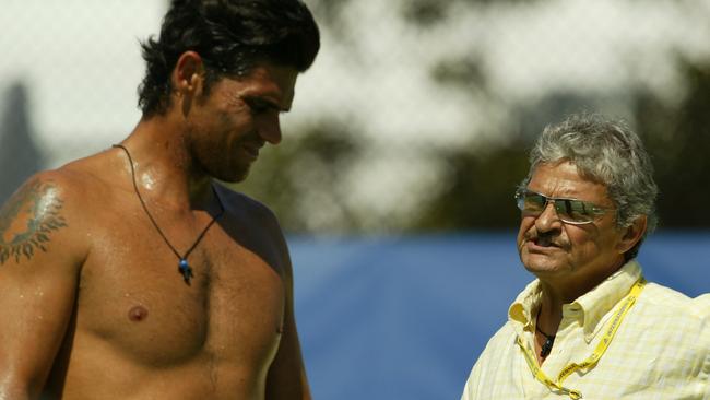 YDNEY, AUSTRALIA - JANUARY 11: (L-R) Mark Philippoussis of Australia talks with his father Nick during a training session during the Adidas International at the Sydney International Tennis Centre on January 11, 2004 in Sydney, Australia. (Photo by Nick Laham/Getty Images)